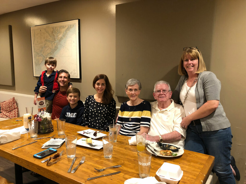 My sister and family, my parents, and me at dinner