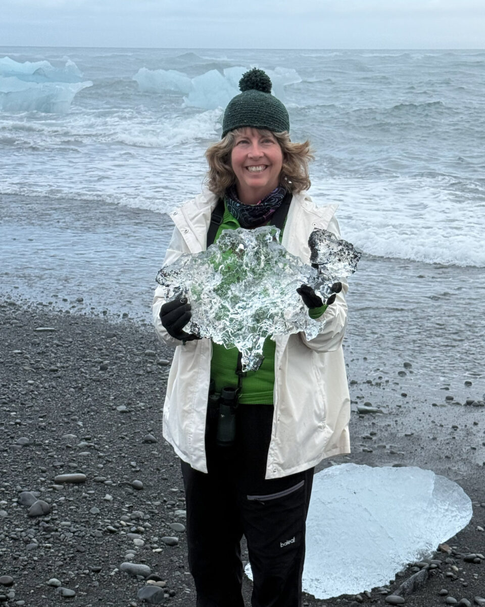 Susan holding a small iceberg at Diamond Beach